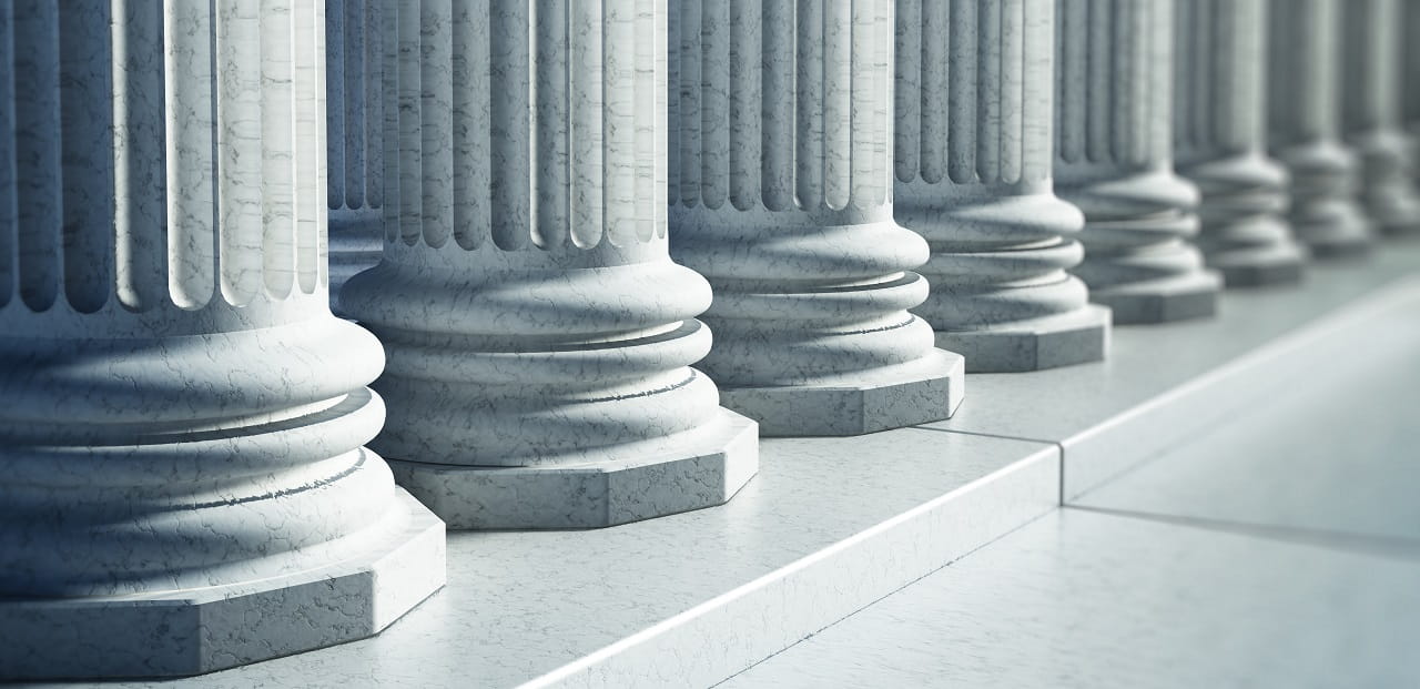 The base of several large marble columns.