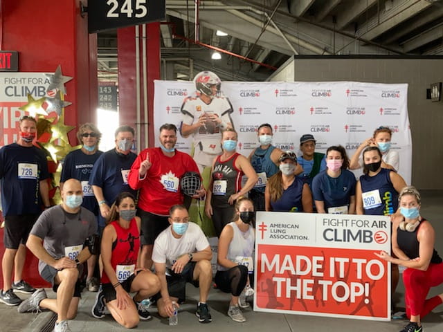 The RJ Bulls pose at Raymond James Stadium at the 2021 Fight for Air Climb