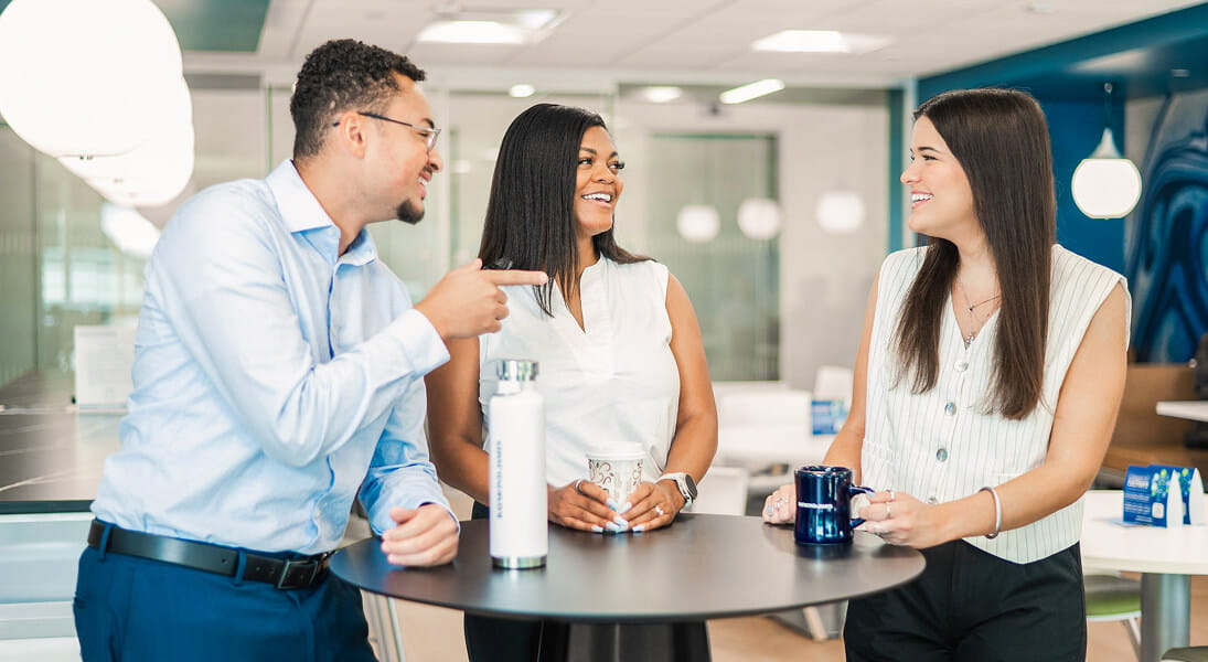 Students discuss early careers at stand up table