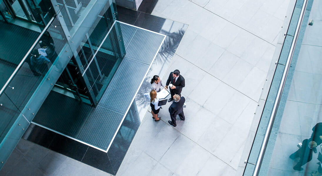 Associates standing outside chatting