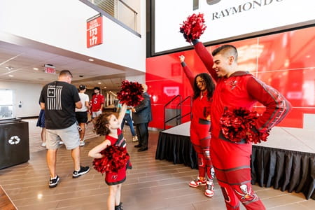 Bucs cheerleaders pose with young girl